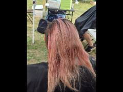 A precise cross beneath a lifted crown braid—faith forward, beautifully worn.