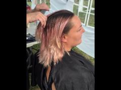 A precise cross beneath a lifted crown braid—faith forward, beautifully worn.