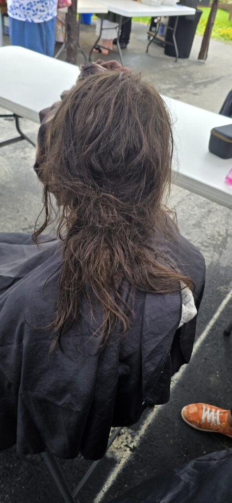 Before haircut at Lighthouse Church outreach event