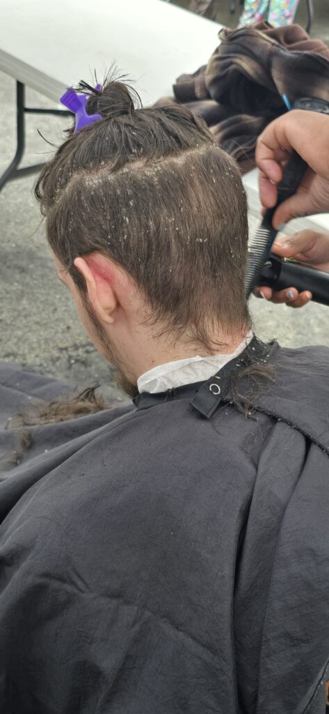 Before haircut at Lighthouse Church outreach event