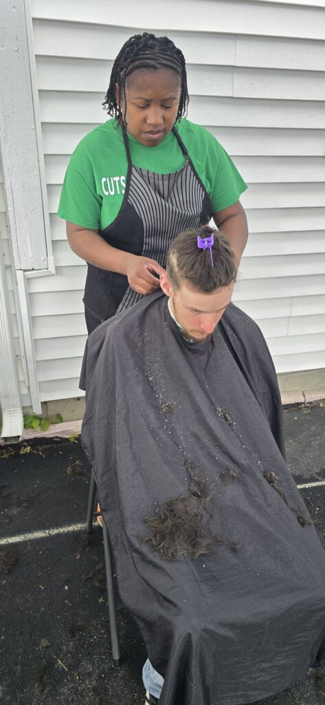 Before haircut at Lighthouse Church outreach event