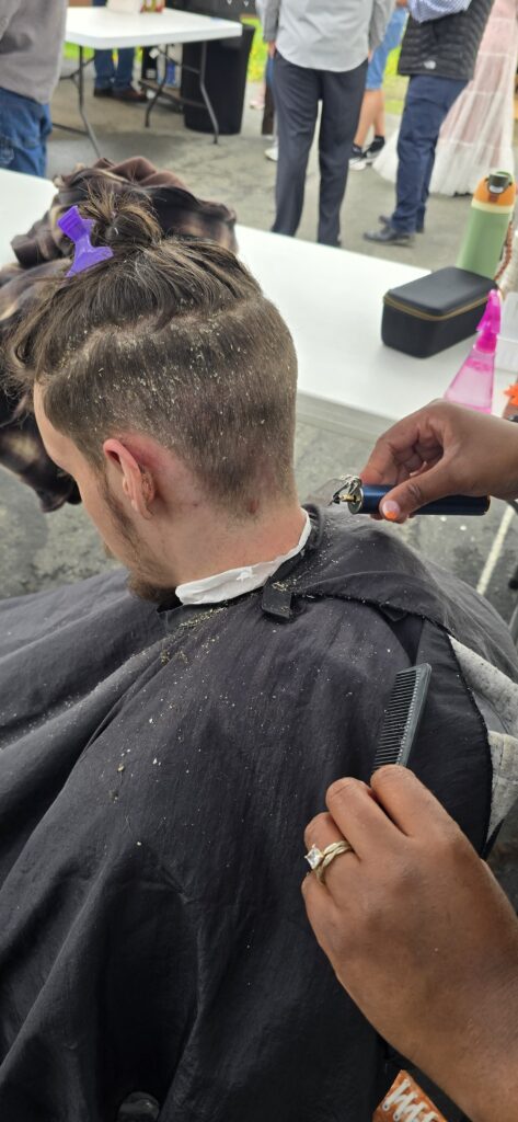 Before haircut at Lighthouse Church outreach event