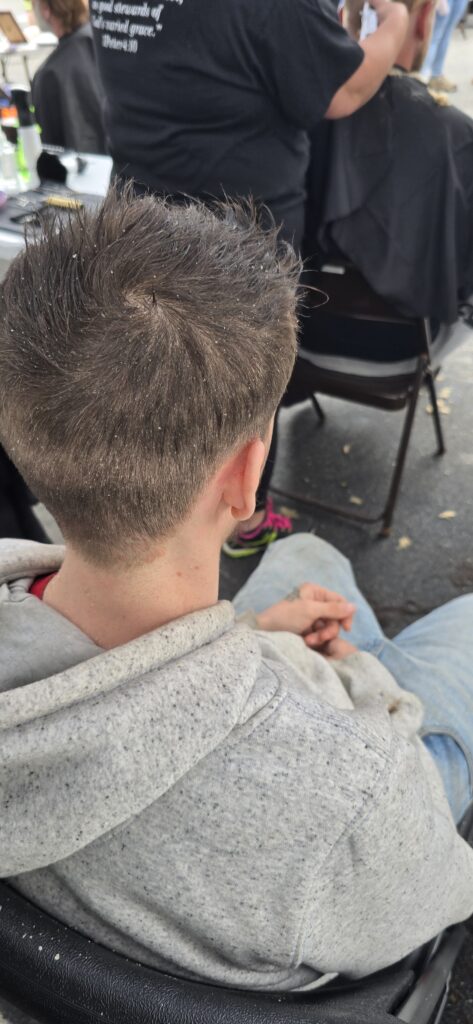 After haircut transformation at Cuts 4 Christ Lighthouse event