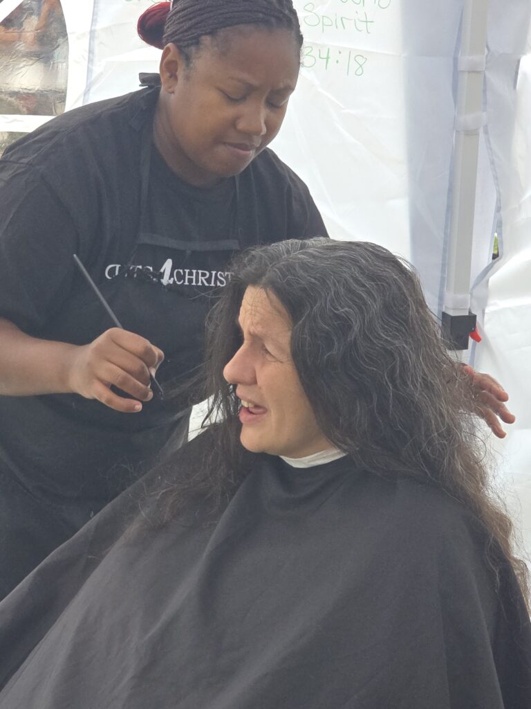 Long hair before trim and braid at Cuts 4 Christ outreach event
