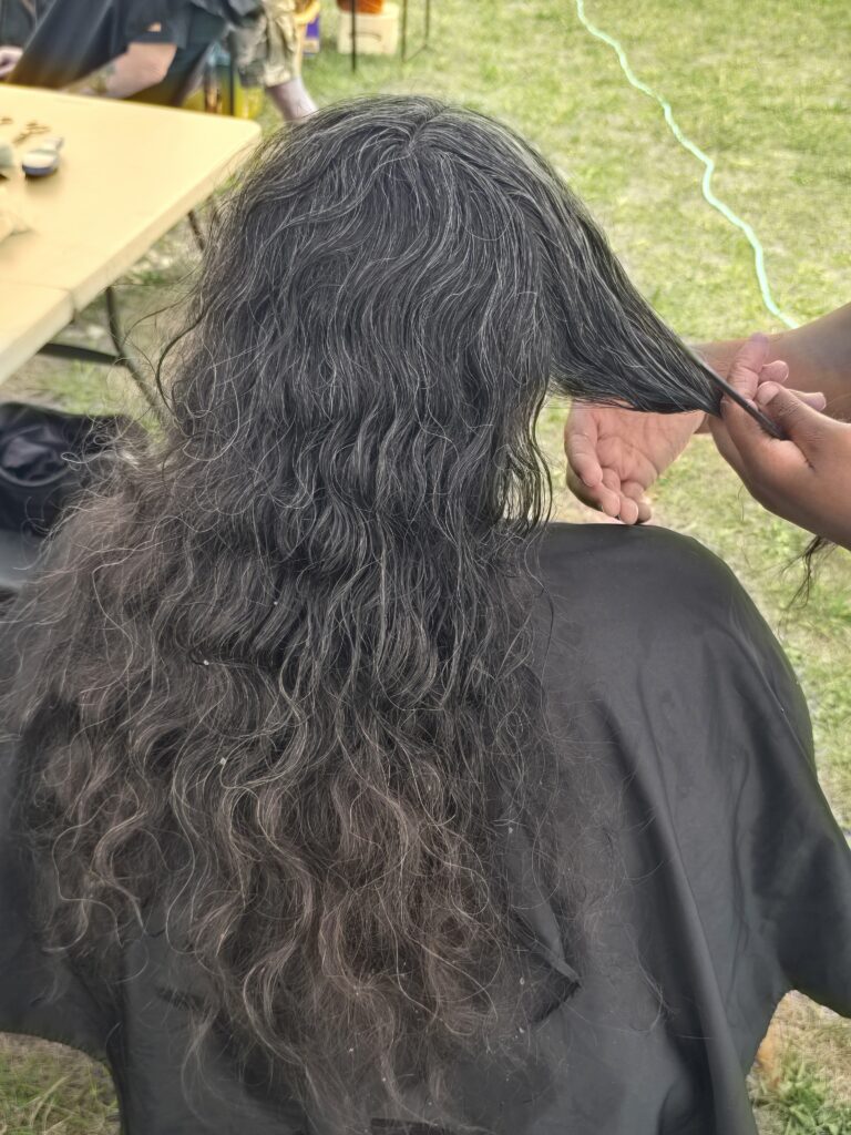 Long hair before trim and braid at Cuts 4 Christ outreach event