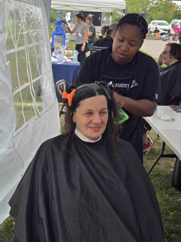 Long hair before trim and braid at Cuts 4 Christ outreach event