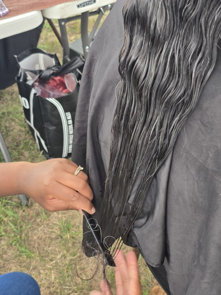 Long hair before trim and braid at Cuts 4 Christ outreach event