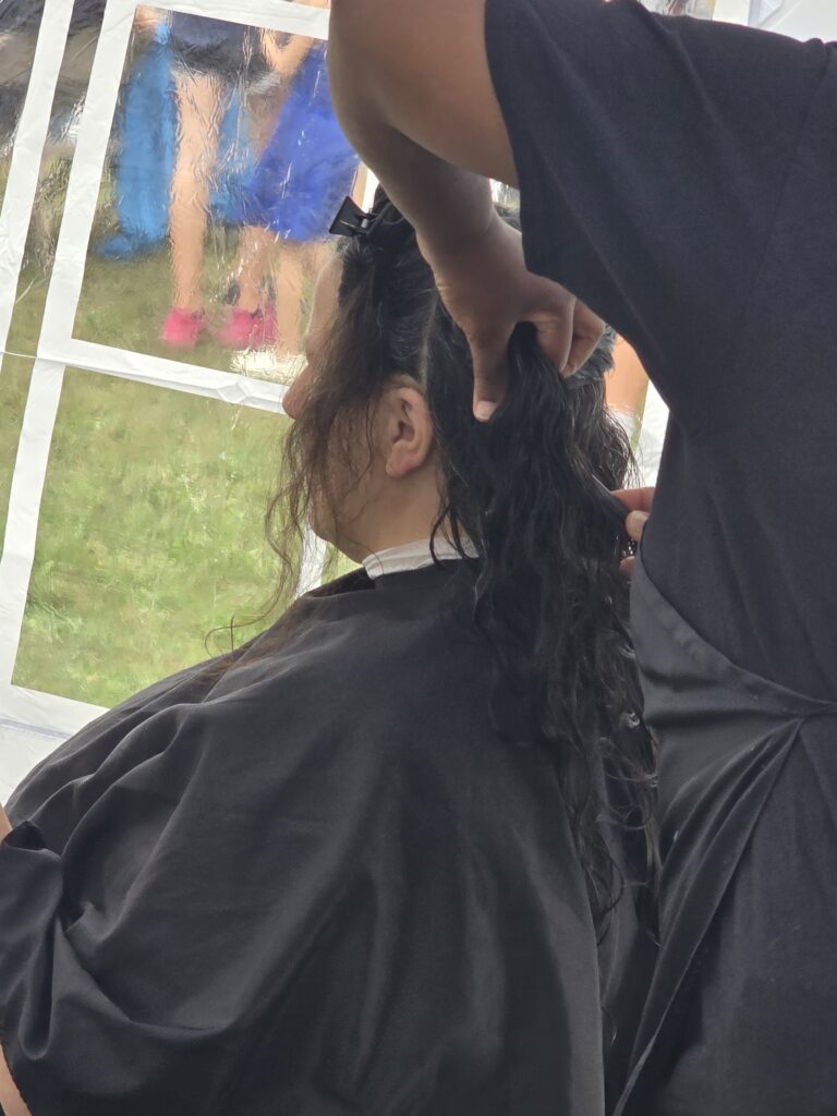 Long hair before trim and braid at Cuts 4 Christ outreach event