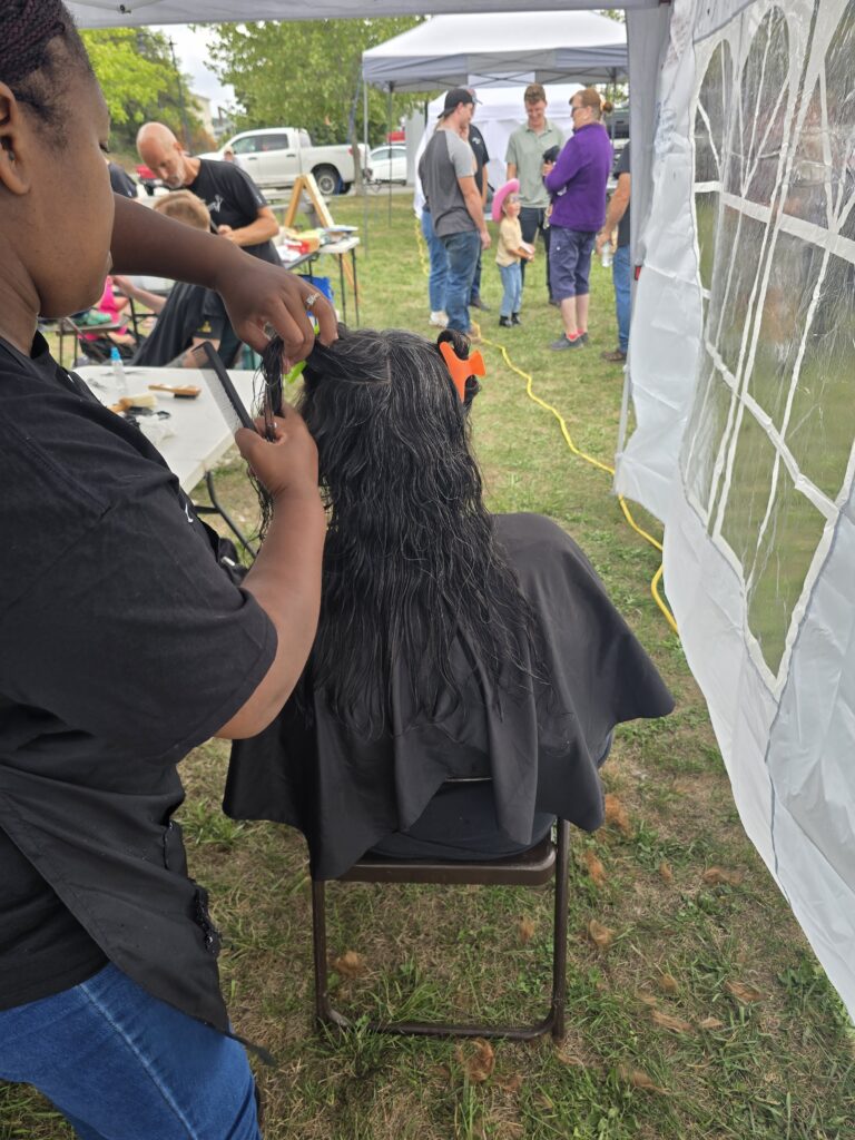 Long hair before trim and braid at Cuts 4 Christ outreach event