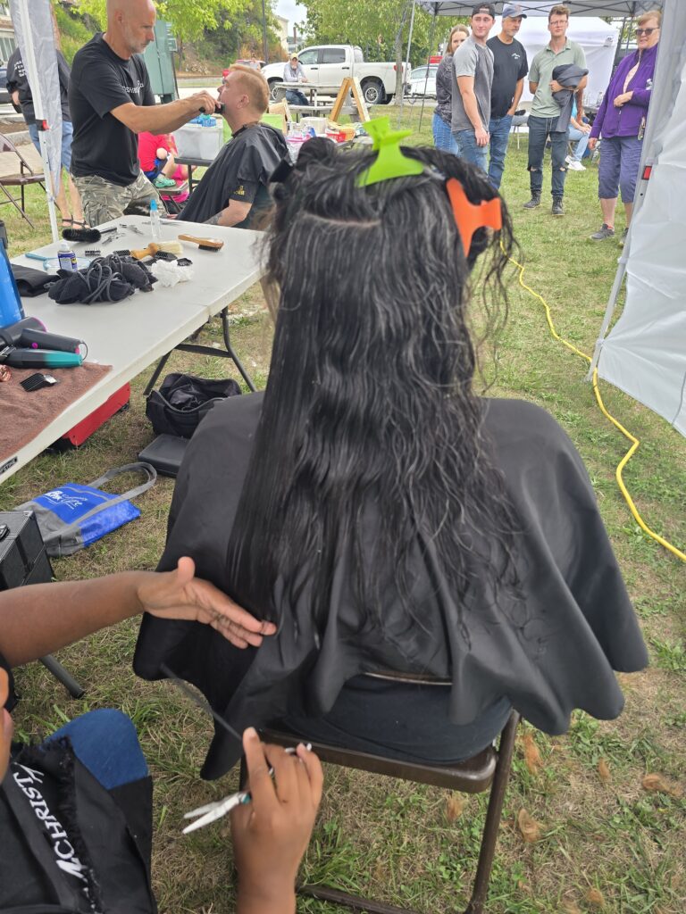 Long hair before trim and braid at Cuts 4 Christ outreach event