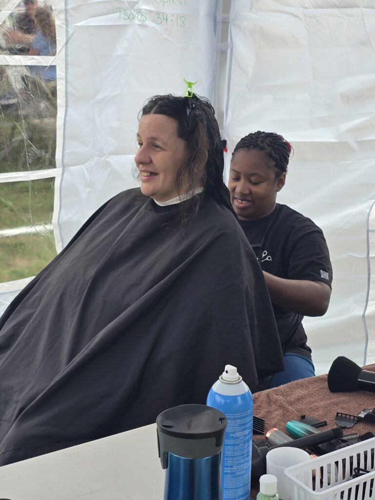 Long hair before trim and braid at Cuts 4 Christ outreach event