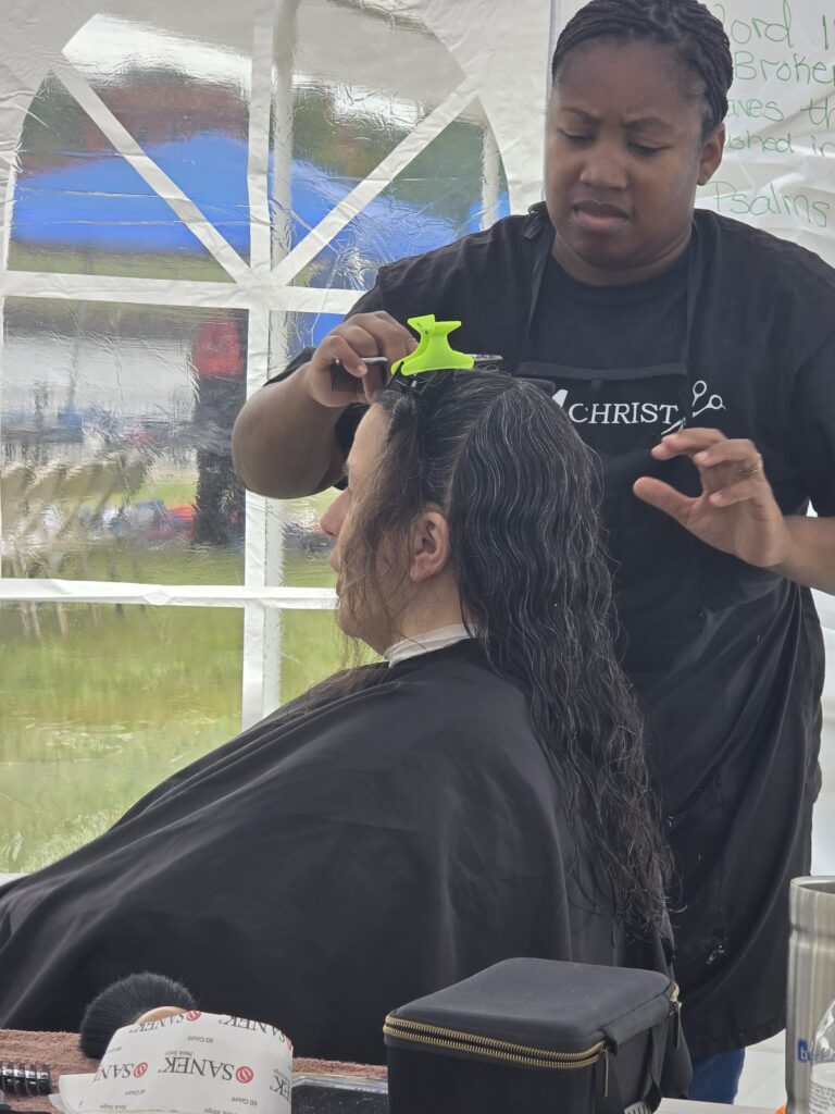 Long hair before trim and braid at Cuts 4 Christ outreach event