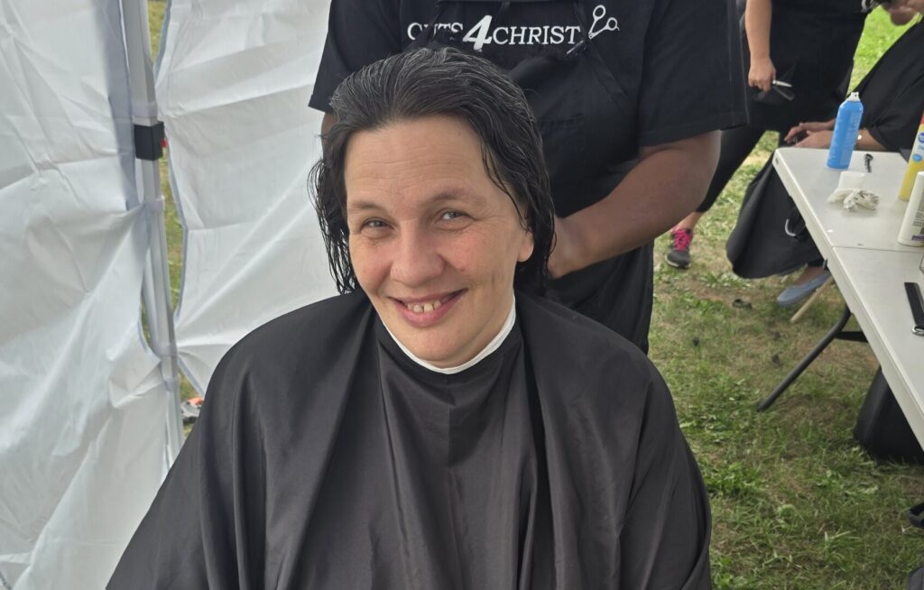 Long hair before trim and braid at Cuts 4 Christ outreach event