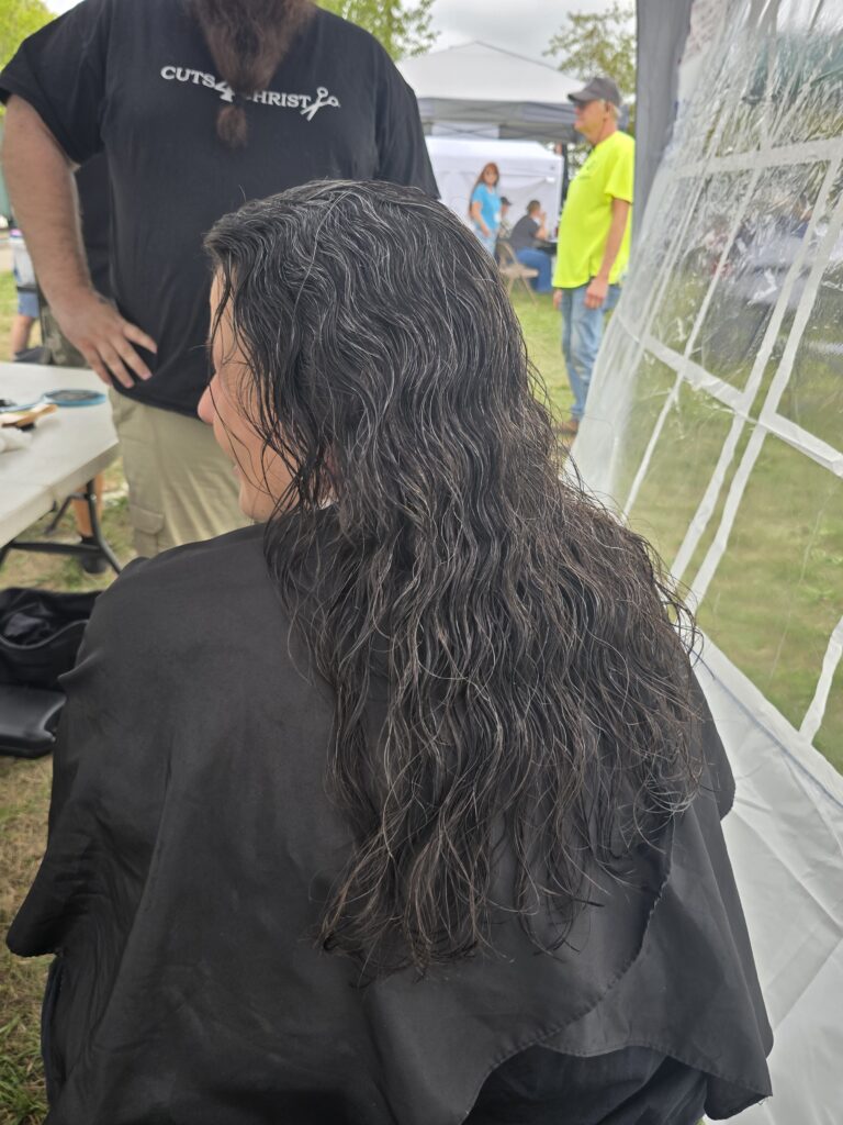 Long hair before trim and braid at Cuts 4 Christ outreach event