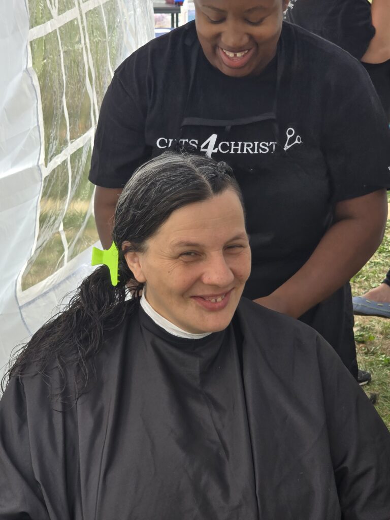Long hair before trim and braid at Cuts 4 Christ outreach event