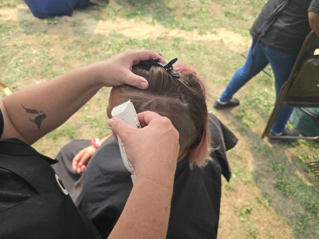 Hair before crossfade braid haircut at Day of Joy outreach event