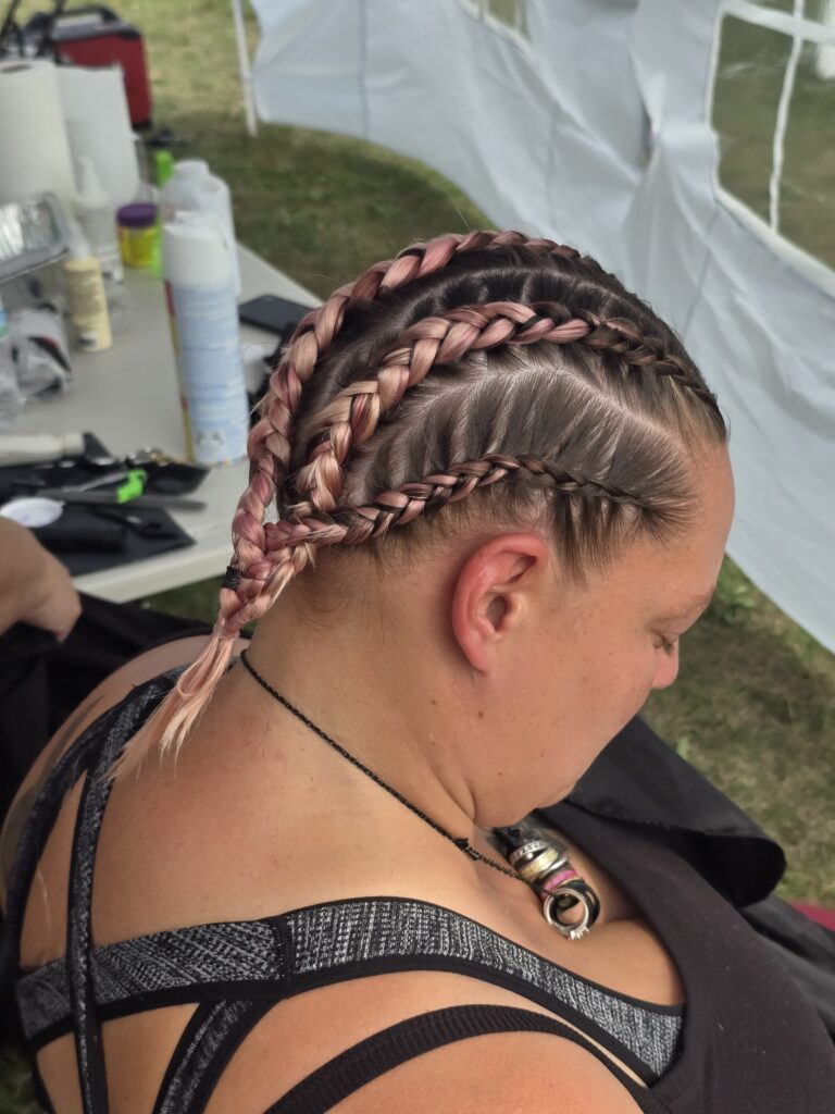 Crossfade braid haircut with shaved cross at Day of Joy outreach event