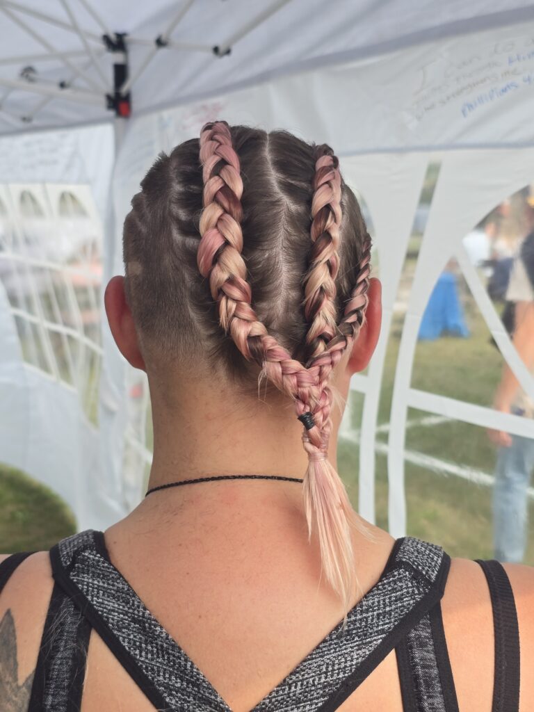 Crossfade braid haircut with shaved cross at Day of Joy outreach event