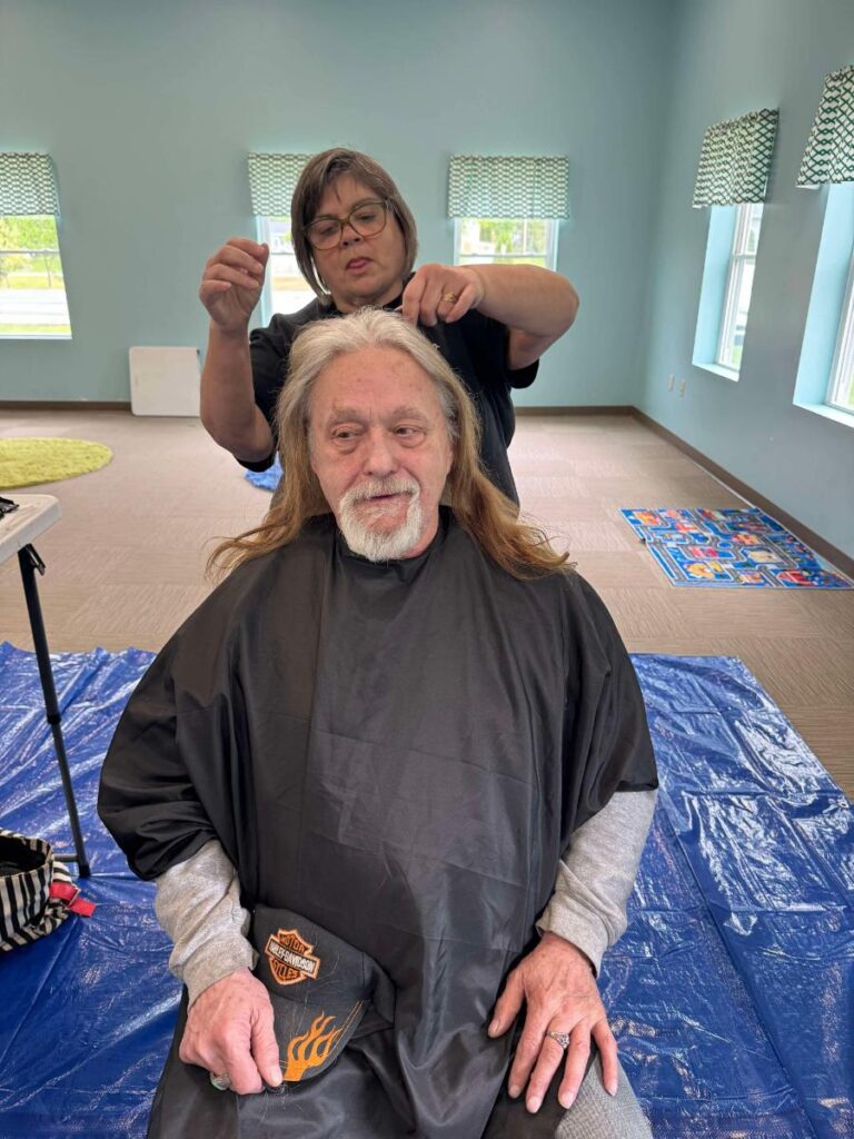 Before haircut at Cuts 4 Christ outreach event